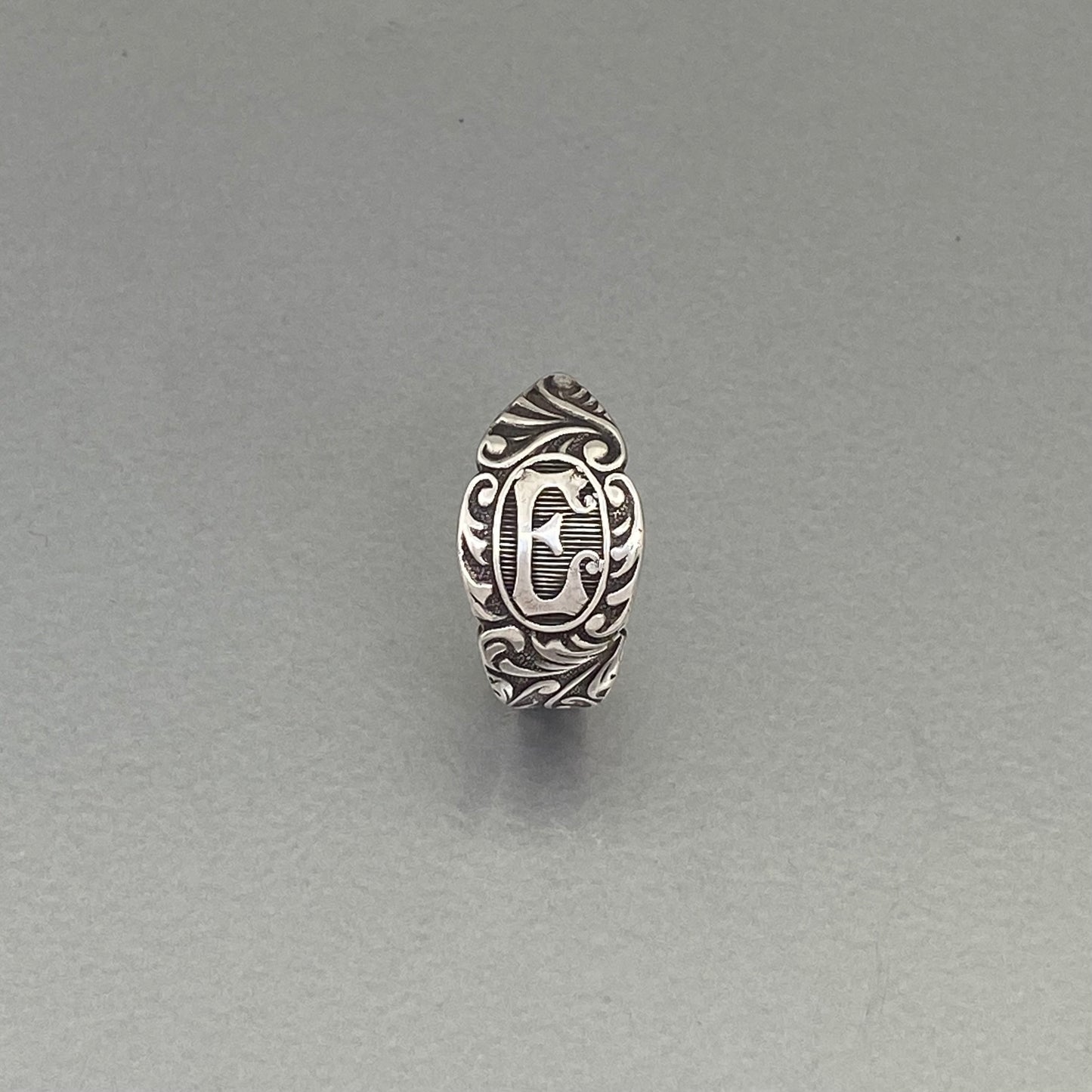 Initial ring E, curly