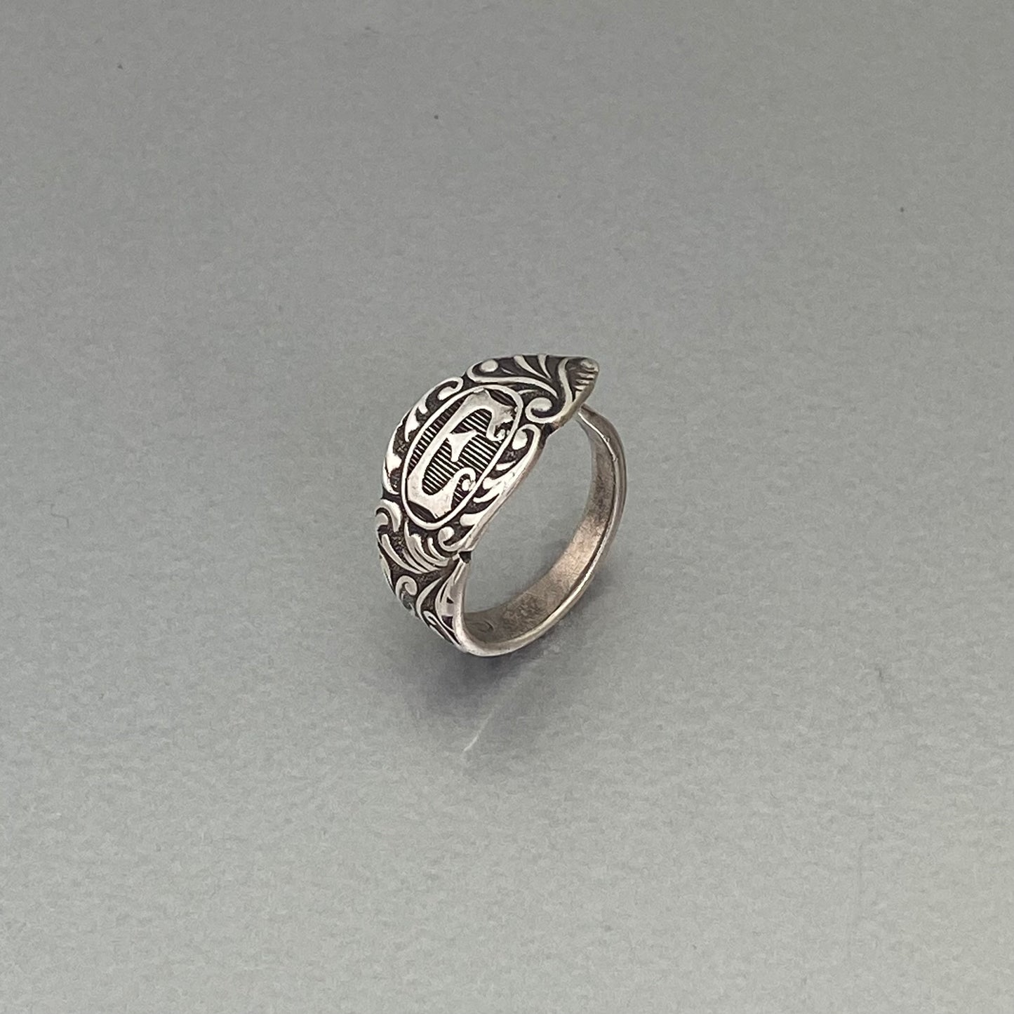 Initial ring E, curly