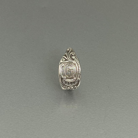 Initial G curly