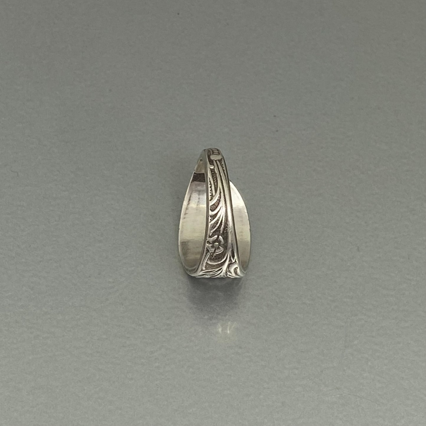 Initial G curly