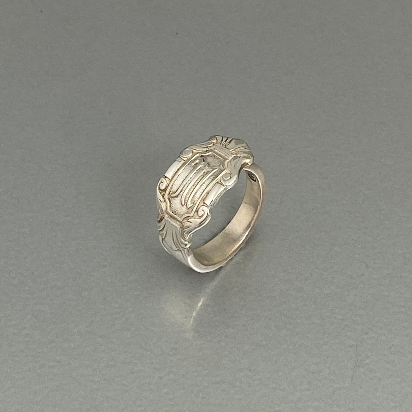 Initial M crown